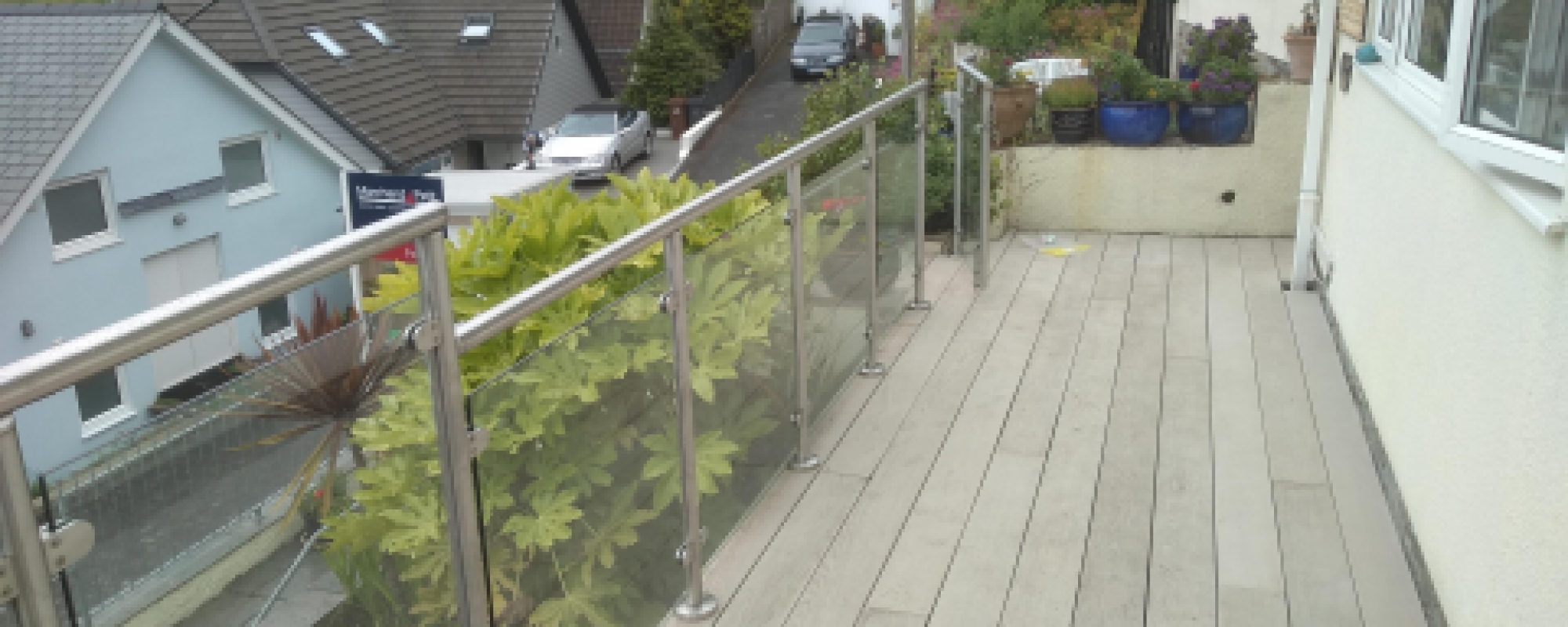 Millboard deck with stainless and Glass